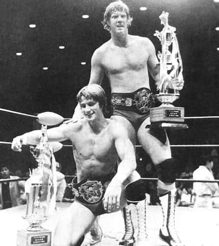 Kevin (left) and David (right) Von Erich celebrate winning the All Asia Tag Team...