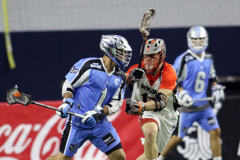 Ohio Machine attacker Marcus Holman (1) surveys the defense as Denver Outlaws midfielder...