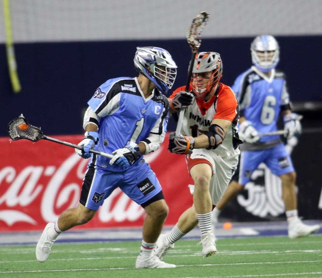 Ohio Machine attacker Marcus Holman (1) surveys the defense as Denver Outlaws midfielder...