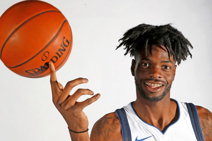 Mavericks forward/center Nerlens Noel poses for a photograph during the media day at...