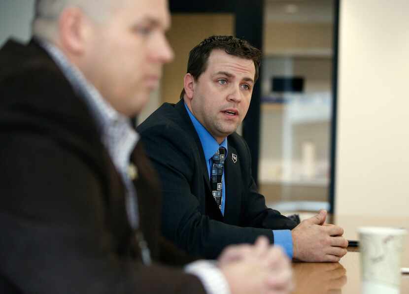 Republican Chad Prda (right), a candidate for sheriff, answers questions from the Dallas...