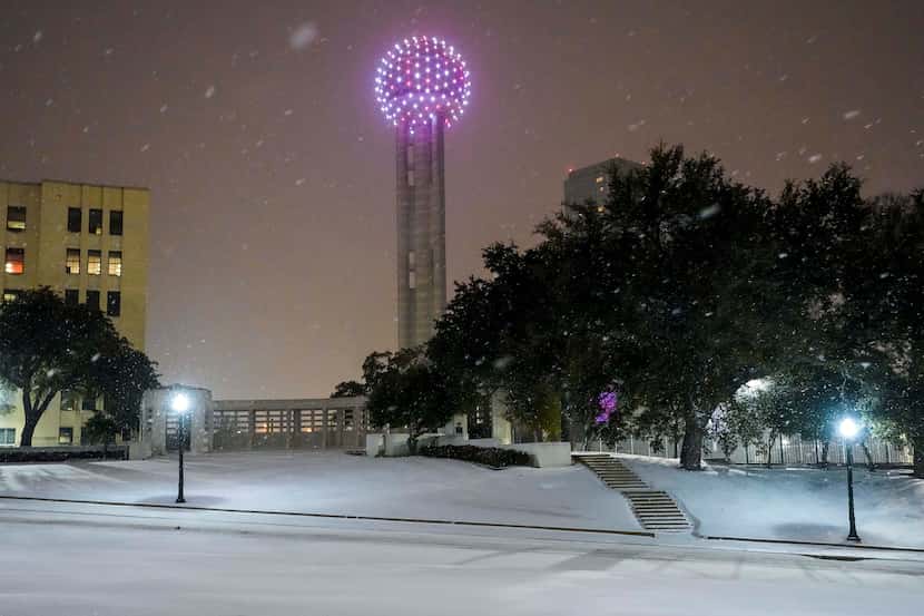 Snow falls on Dealey Plaza and Reunion Tower in downtown Dallas in February 2021.