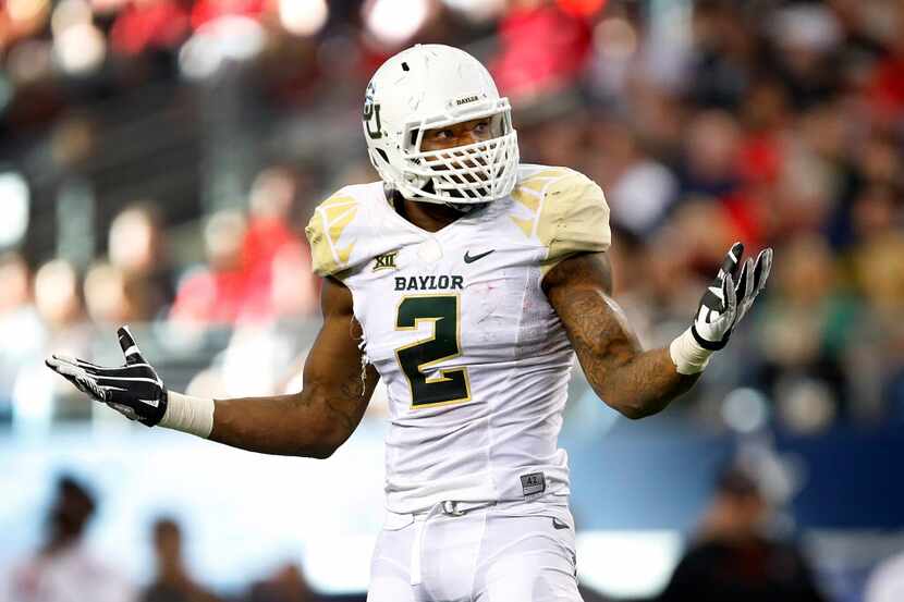 Baylor Bears defensive end Shawn Oakman (2) reacts after making a tackle in the first half...
