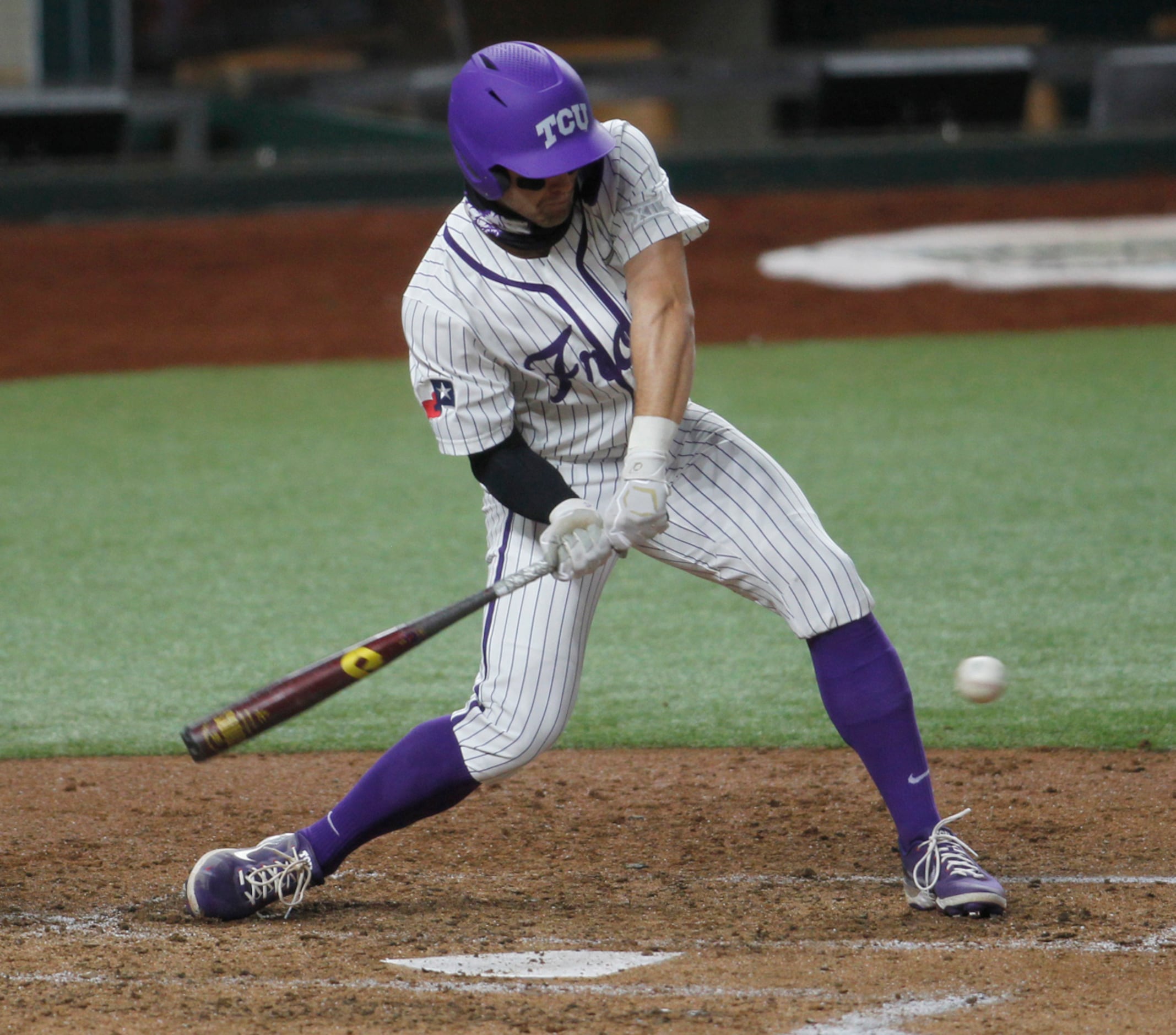 TCU center fielder Hunter Wolfe (6) is unable to connect or hold up on his swing as he is...