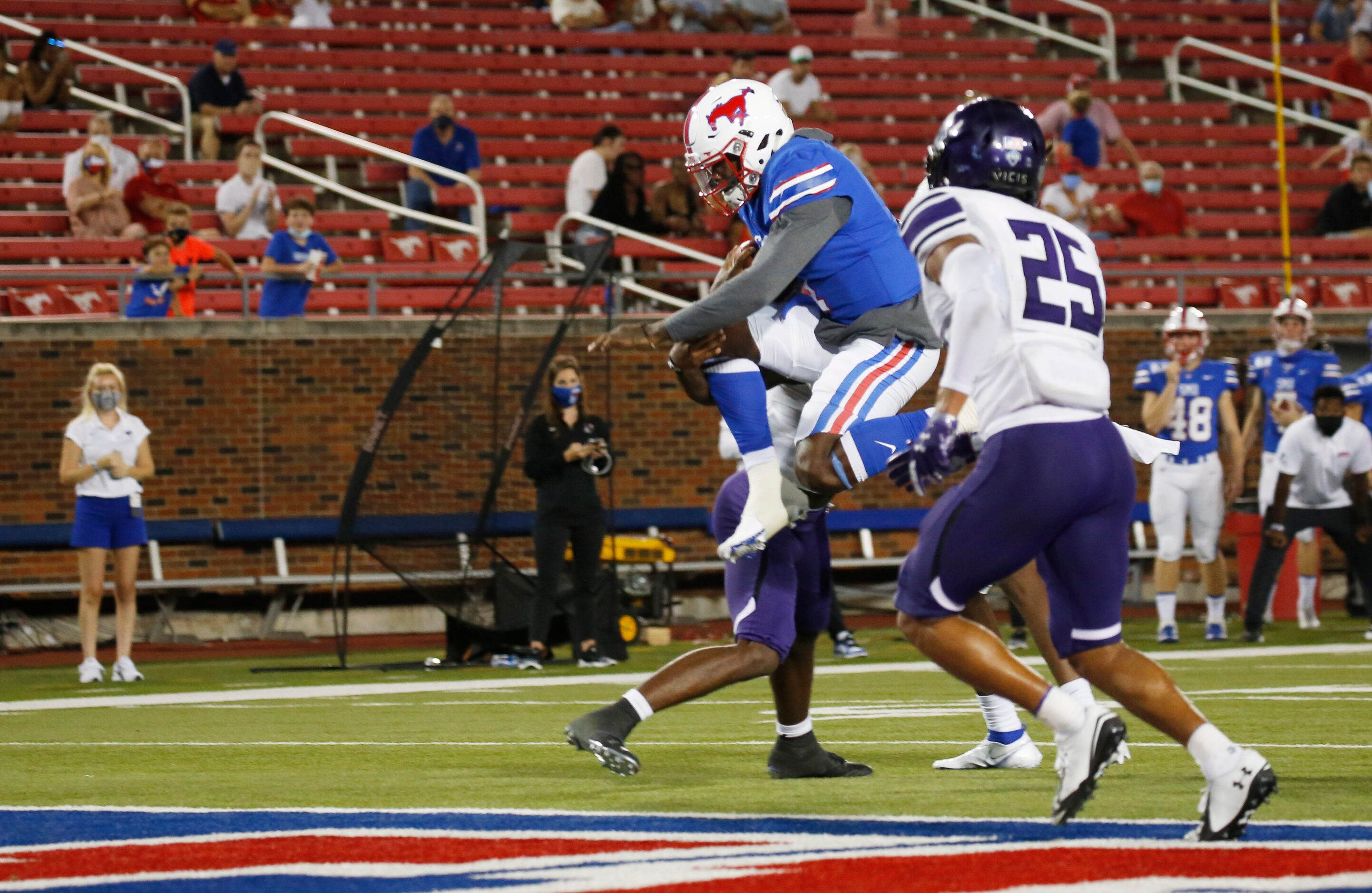 Southern Methodist Mustangs quarterback Terrance Gipson (1) leaps into the end zone for a...