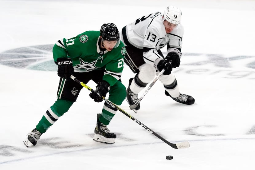 Dallas Stars left wing Jason Robertson (21) works the puck up ice on Los Angeles Kings...