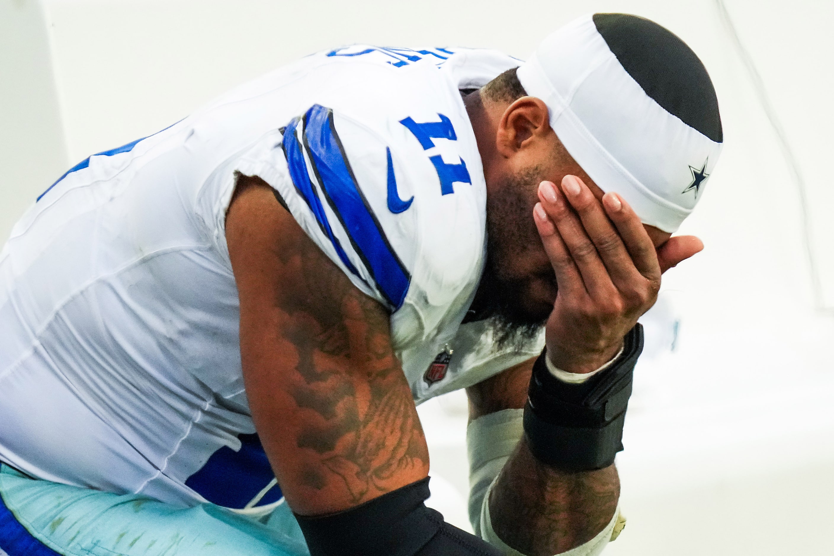 Dallas Cowboys linebacker Micah Parsons sits on the bench during the second half of a loss...