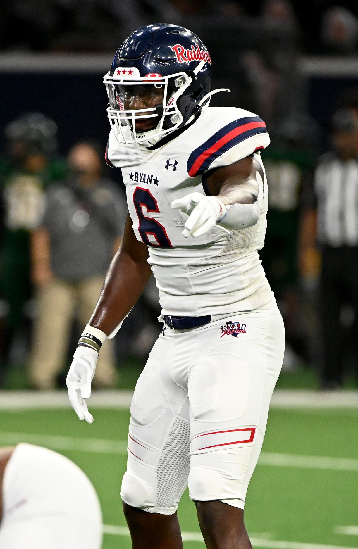 Anthony Hill Jr. lines up on defense in the first half during a high school football game...