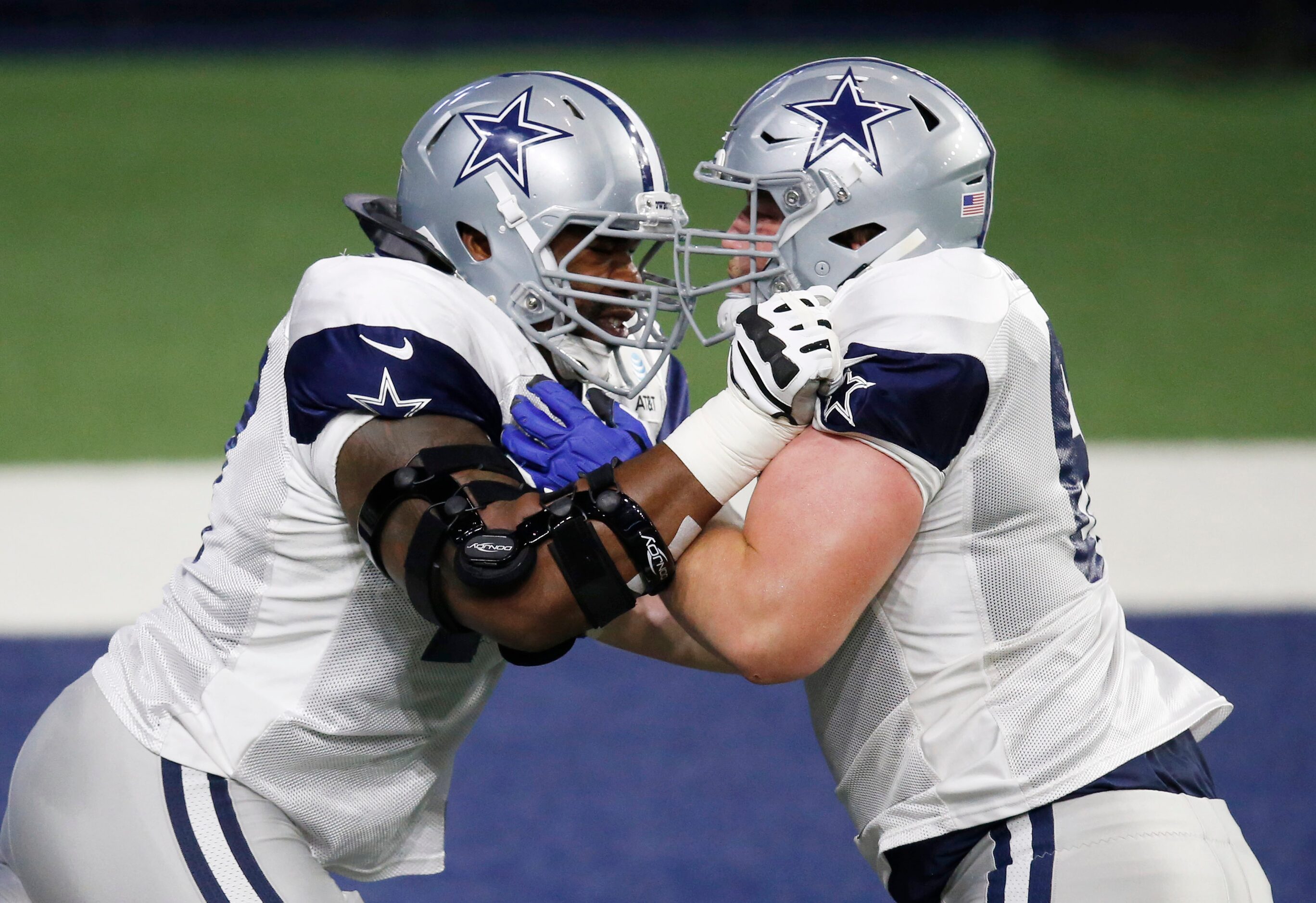 Dallas Cowboys offensive tackle Tyron Smith (77) blocks Dallas Cowboys center Adam Redmond...