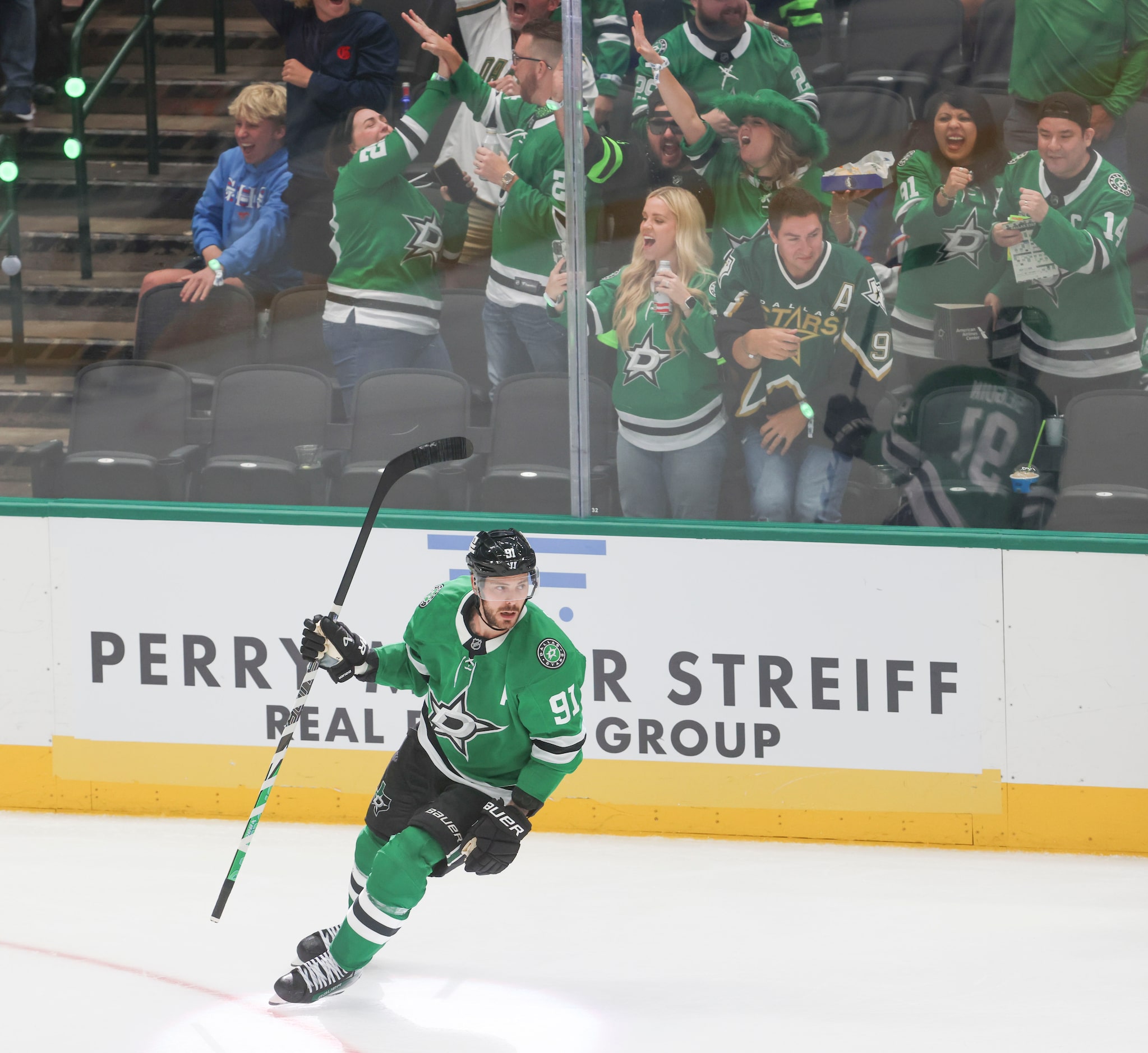 Crowd cheers as Dallas Stars center Tyler Seguin loos back after scoring the team’s final...