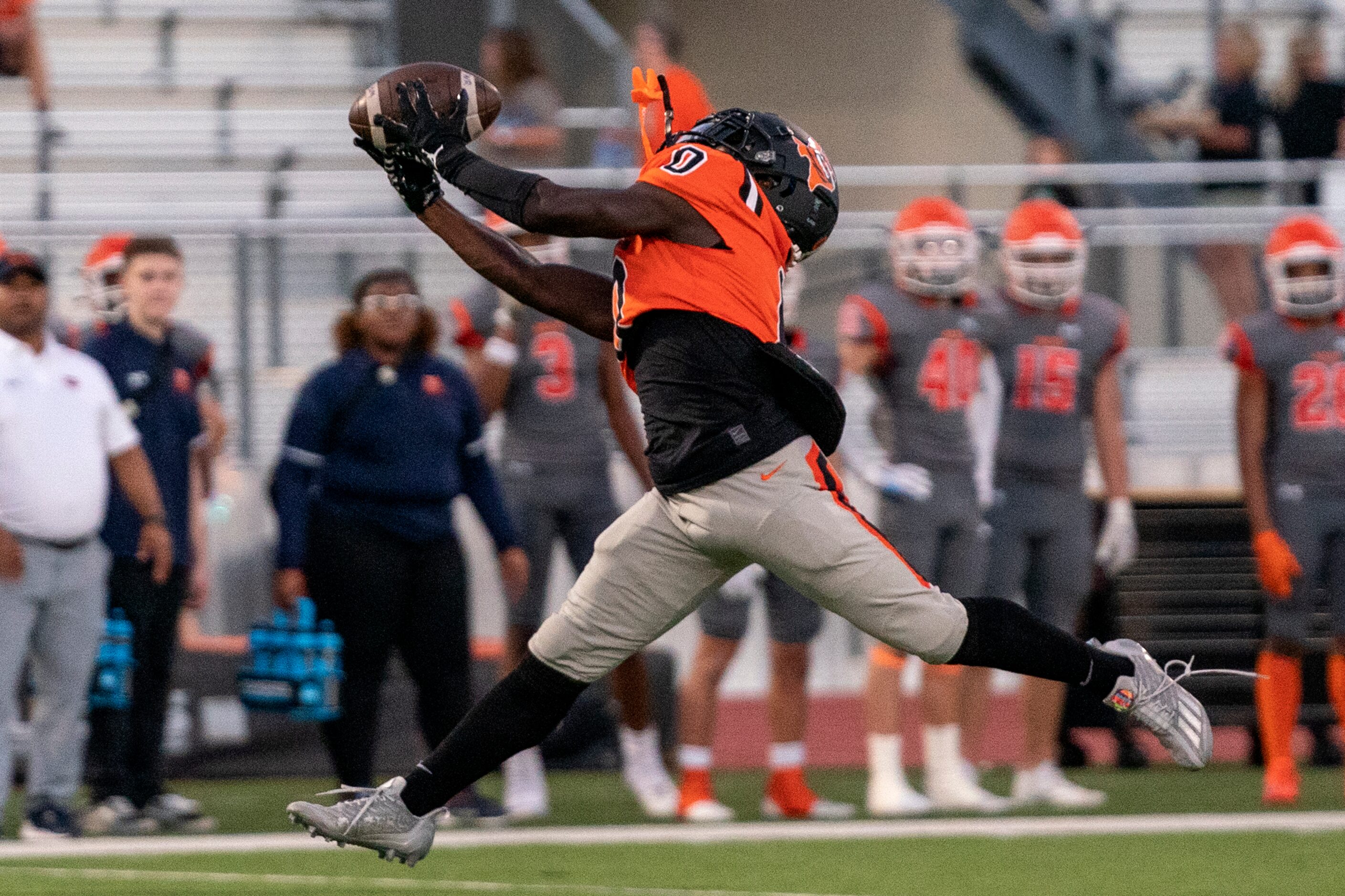 Lancaster junior wide receiver Ti’Erick Martin (0) makes a fingertip catch during the first...