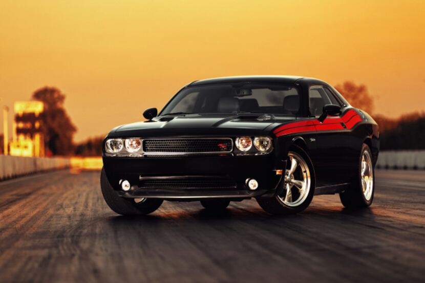 The 2013 Dodge Challenger R/T has two wheels in this century and two in the past, but it's a...