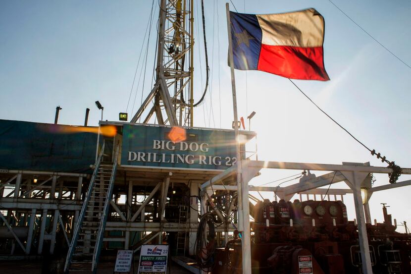 The Texas flag flew at Endeavor Energy Resources's Big Dog Drilling Rig 22 in the Permian...