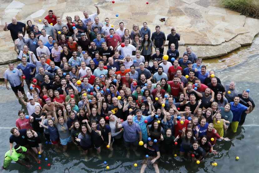 Watermark Community Church staffers pose for a group photo after playing a game, Over the...