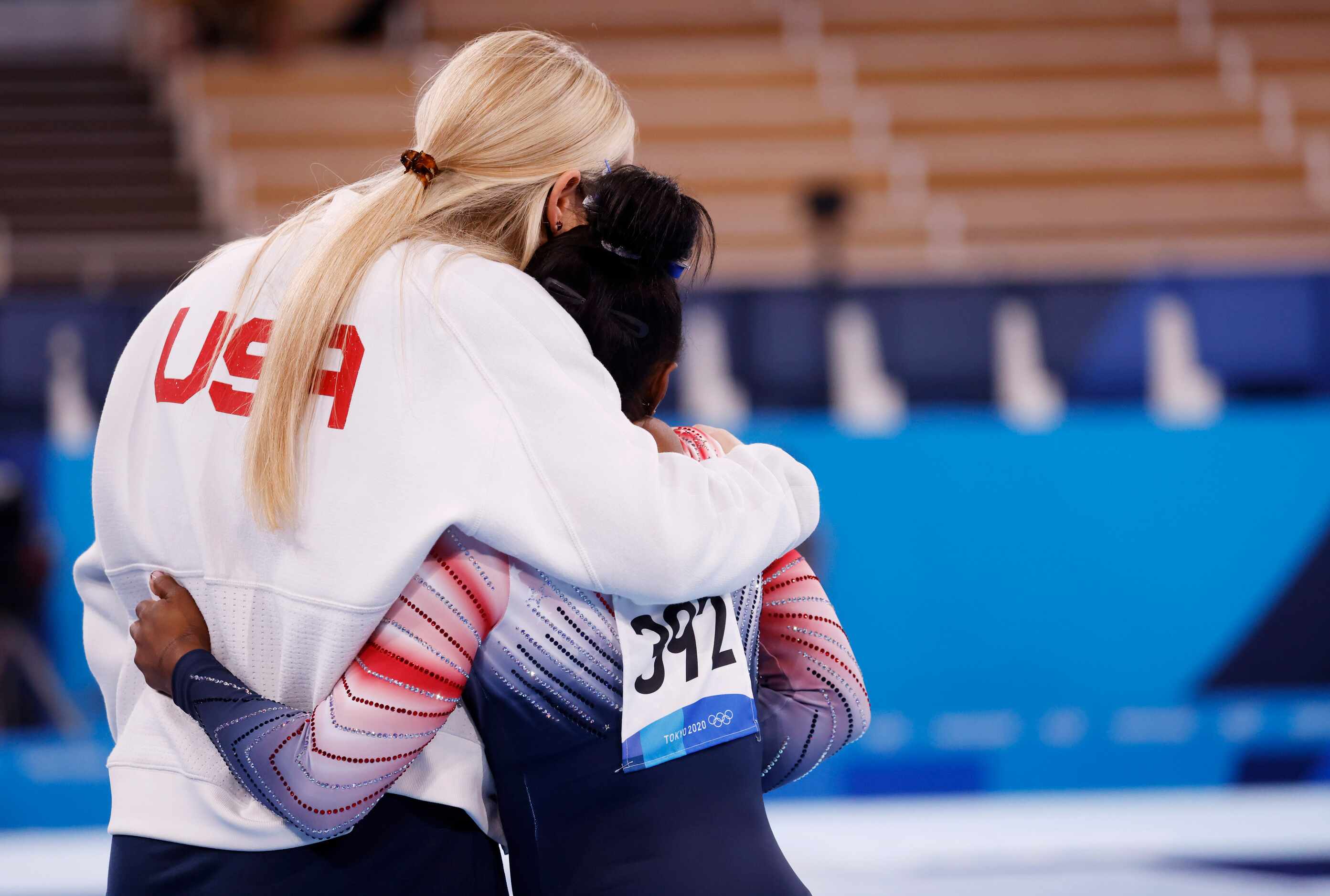 USA’s Simone Biles hugs her coach Cecile Landi before competing in the women’s balance beam...