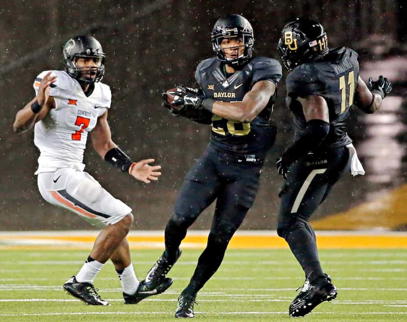 Baylor Bears safety Orion Stewart (28) intercepts a pass meant for Oklahoma State Cowboys...