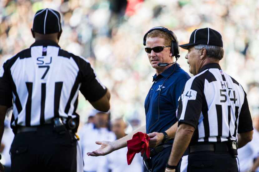 Dallas Cowboys head coach Jason Garrett challenges a call that they did not score a...