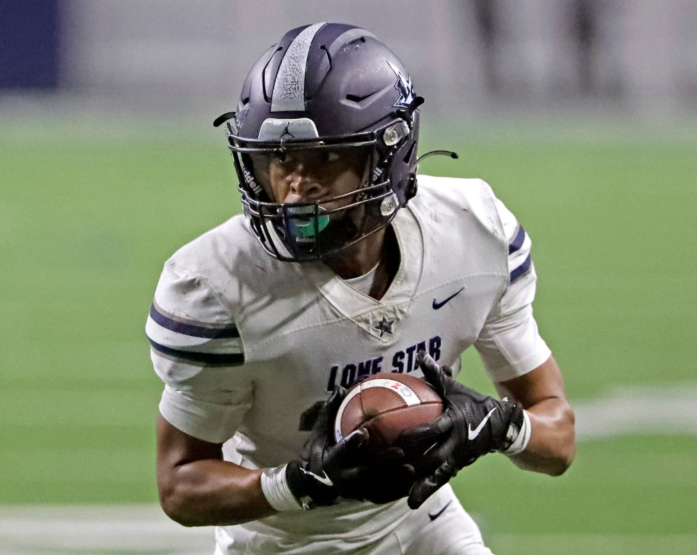 Lone Star High School running back Isaiah Massey (28) runs for a touchdown during the first...