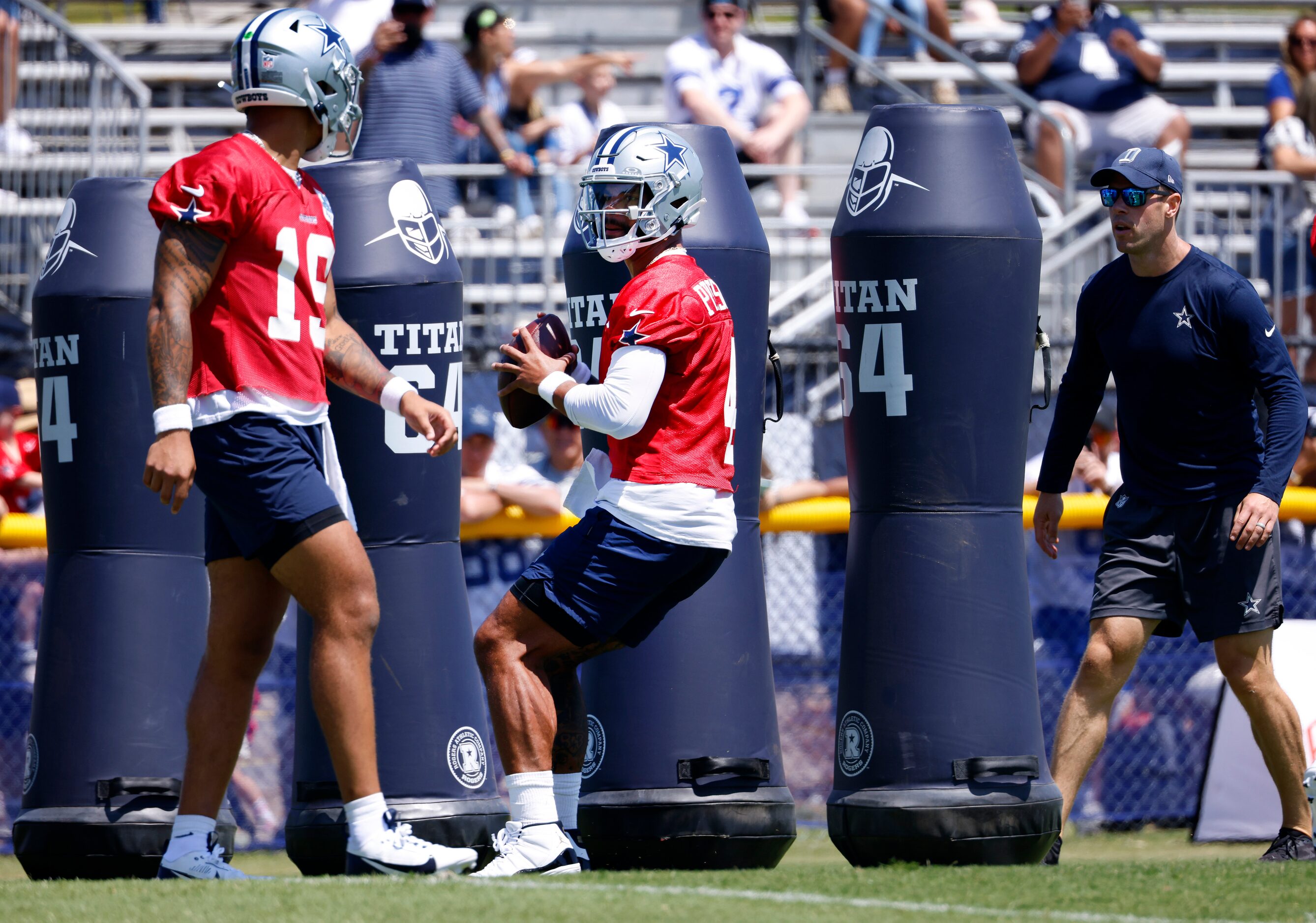 Dallas Cowboys quarterback Dak Prescott (4)  maneuvers through the tackling dummies before...