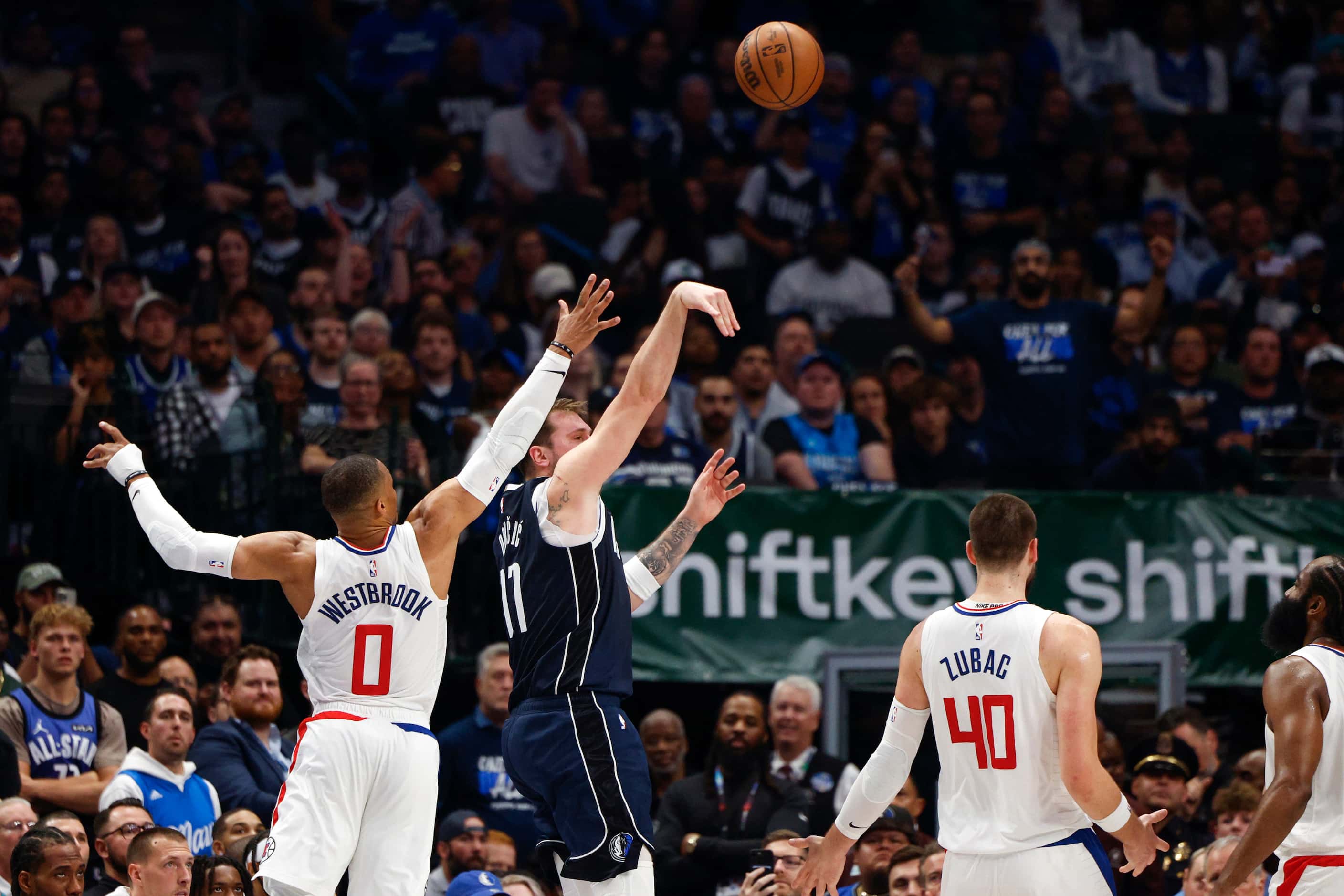 Dallas Mavericks guard Luka Doncic (77) shoots the ball against LA Clippers guard Russell...