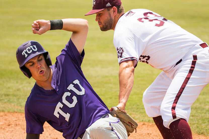 TCU infielder Derek Odell is safe at third base ahead of the tag from Texas A&M infielder...