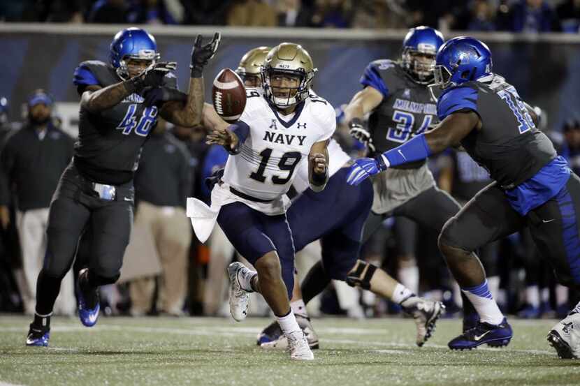Navy quarterback Keenan Reynolds (19) plays against Memphis in the first half of an NCAA...