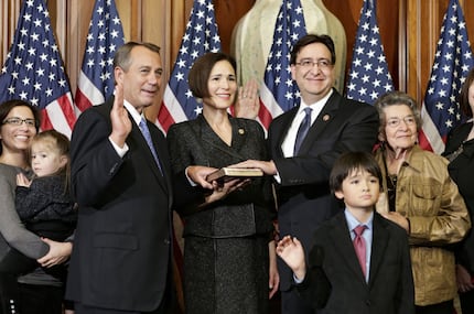 Former Rep. Pete Gallego (right), D-Alpine, and his family posed for a ceremonial photo with...