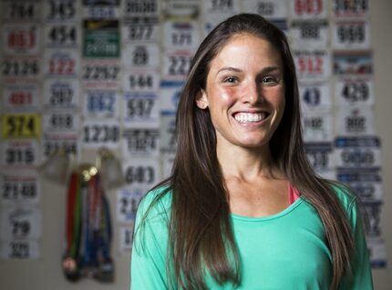 Olympic Trials marathon qualifier Becky Wade poses for a portrait in front of a collection...