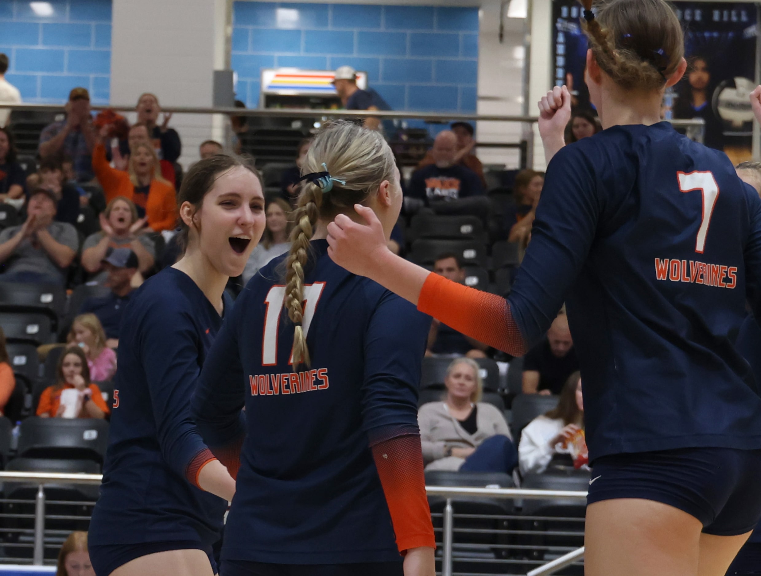 Frisco Wakeland's Keala Bandy (17), center, is congratulated by teammates Eryn Peek (15),...