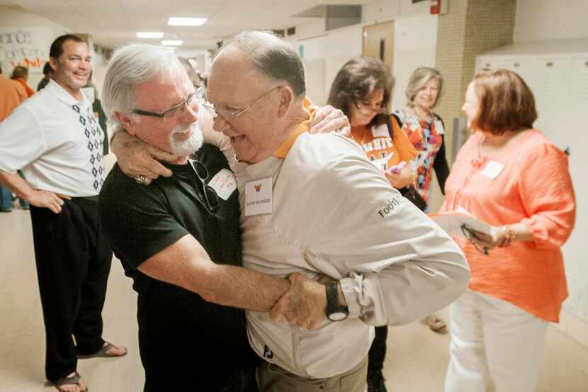 
Kirk Van Sickle (left) hugs former W.T. White baseball coach David Shepherd, the man he...
