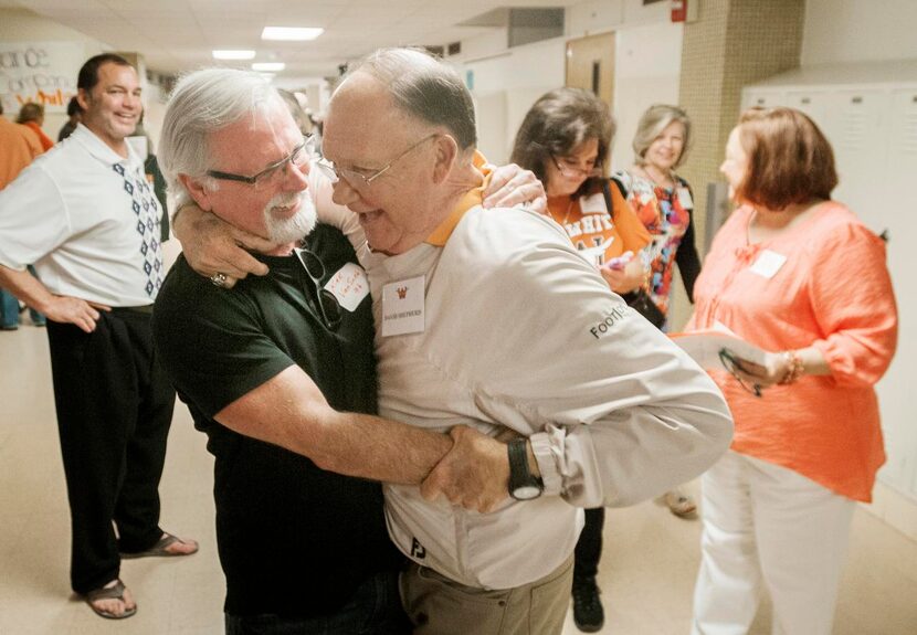 
Kirk Van Sickle (left) hugs former W.T. White baseball coach David Shepherd, the man he...