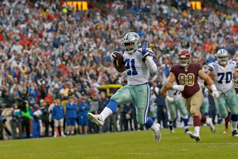 Dallas Cowboys running back Ezekiel Elliott (21) scores a touchdown against Washington...