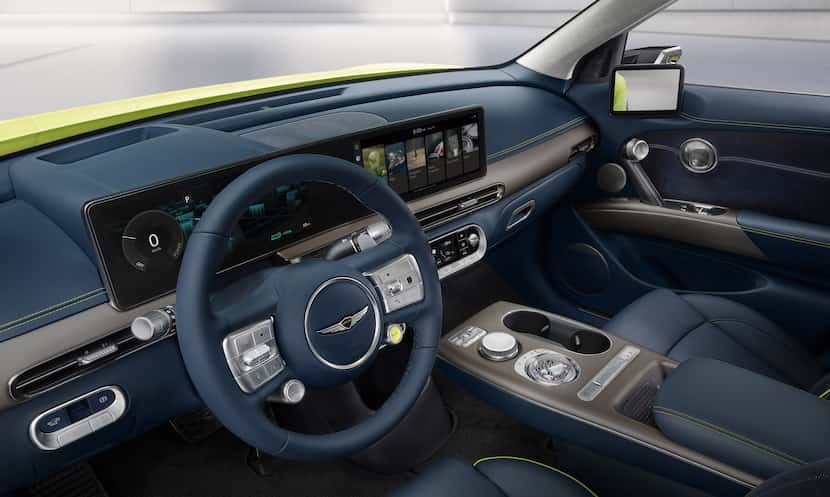 Inside, the Genesis GV60 sports a big, Mercedes-like digital screen stretching across the...