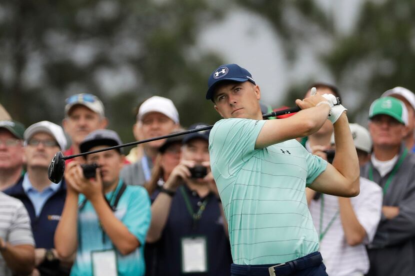 Jordan Spieth hits on the eighth tee during a practice round for the Masters golf tournament...