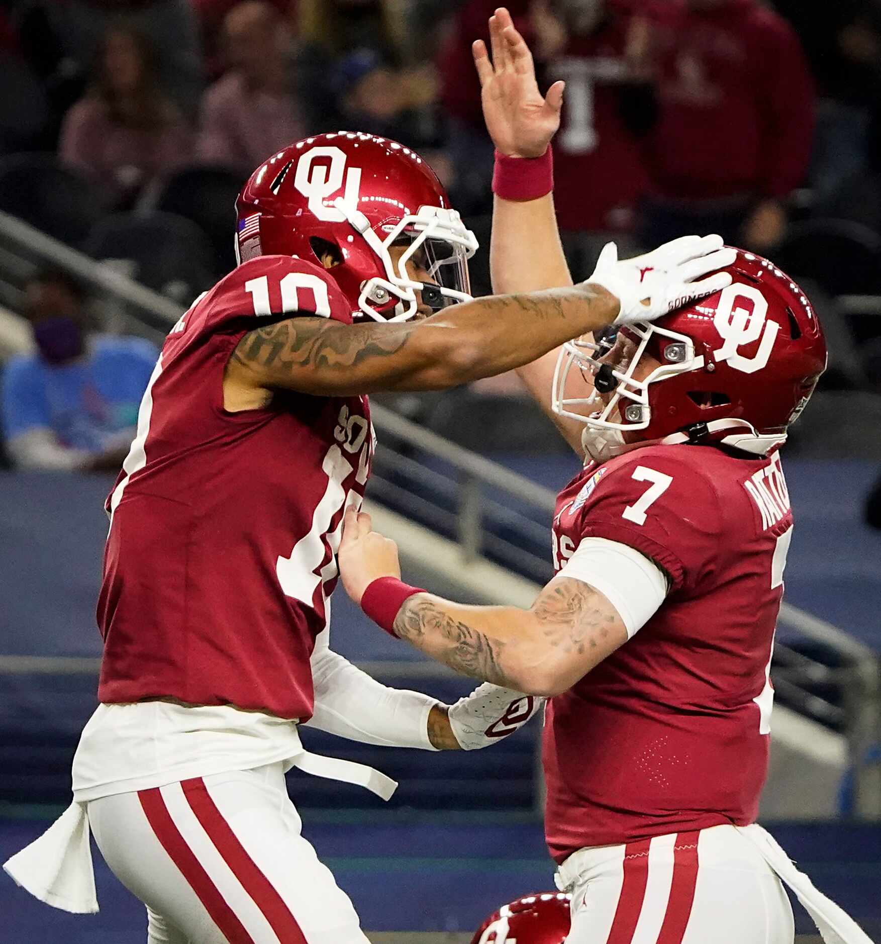 Oklahoma quarterback Spencer Rattler (7) celebrates with wide receiver Theo Wease (10) after...