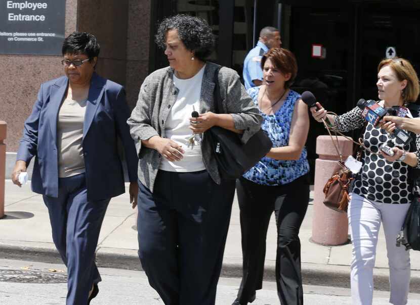 Kathy Nealy (left) left the federal courthouse in 2014 after being charged in the John Wiley...