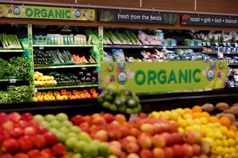 Organic fruits and vegetables are displayed at the Tom Thumb grocery store on Live Oak...
