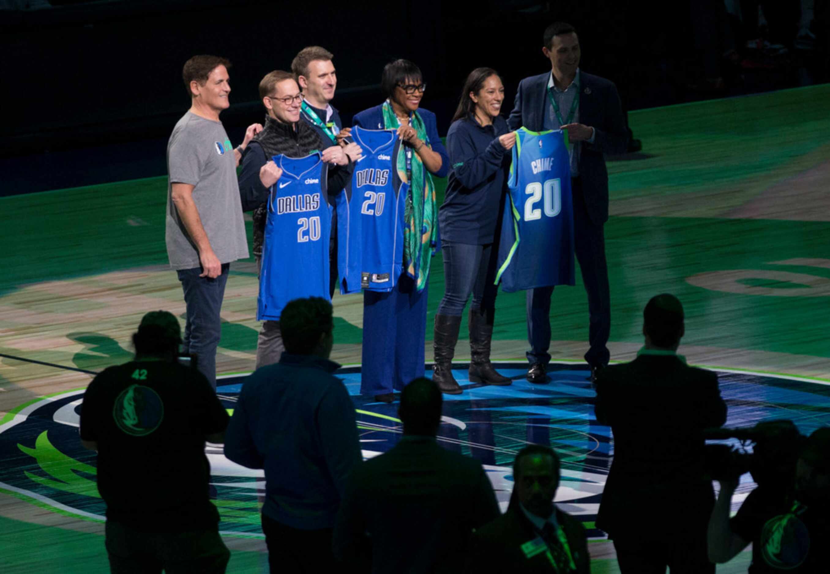 Dallas Mavericks owner Mark Cuban poses for a photo with representatives from Chime during...