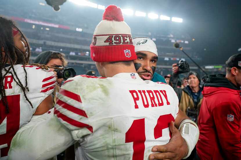 San Francisco 49ers quarterback Brock Purdy (13) talks with Philadelphia Eagles quarterback...