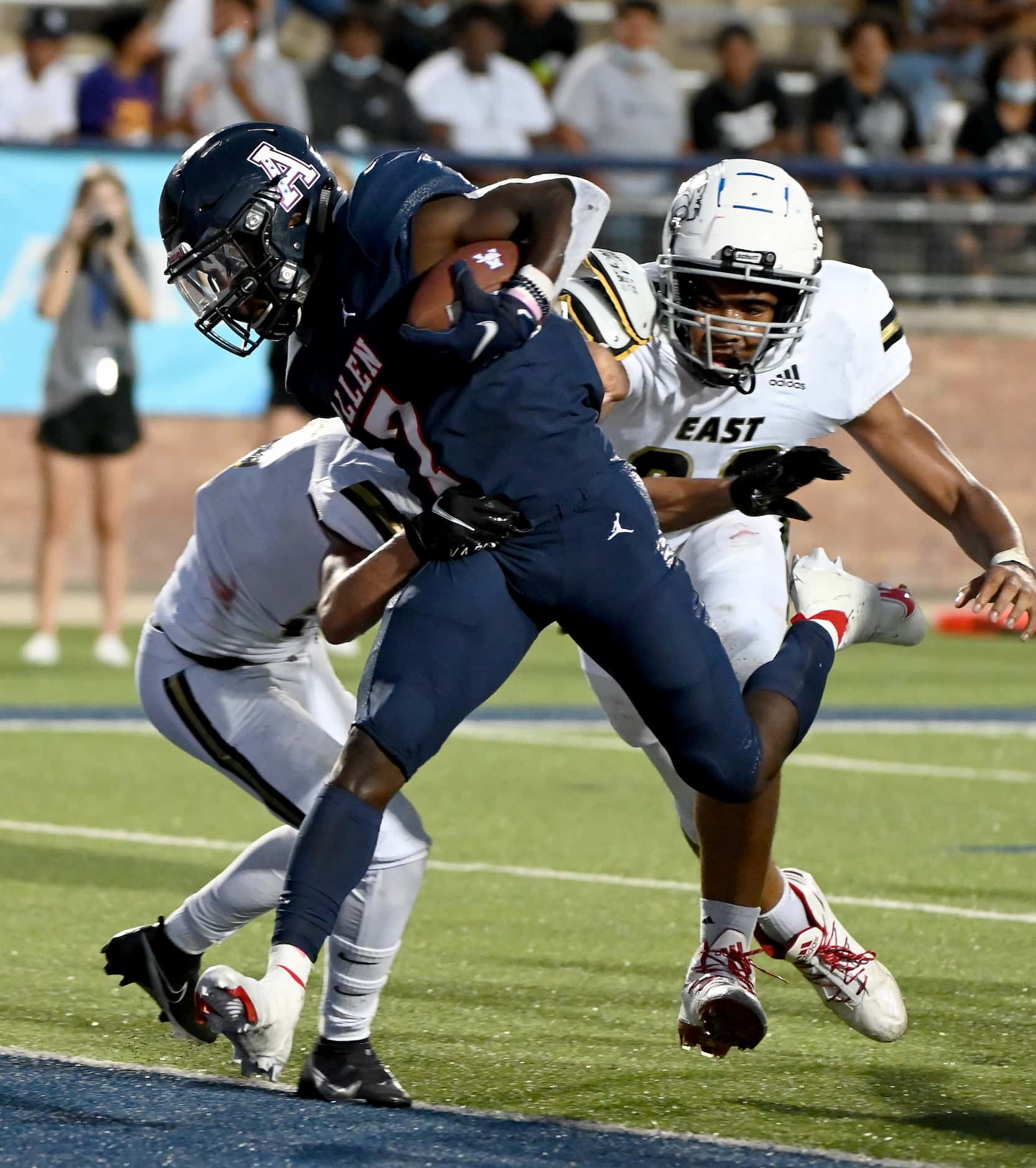 Allen’s Kayvion Sibley scores a first half touchdown in front of Plano East’s Holden Stokes...