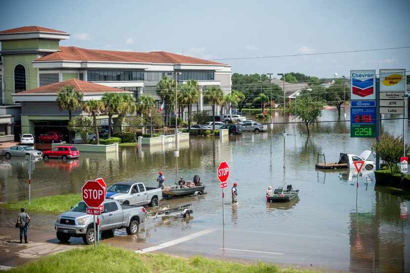 Rescue crews save residents in Port Arthur on Sept. 1, 2017. 
Houston was limping back to...