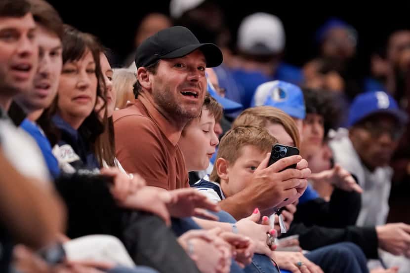 Former Dallas Cowboys quarterback and Tony Romo watches the NBA basketball game between the...