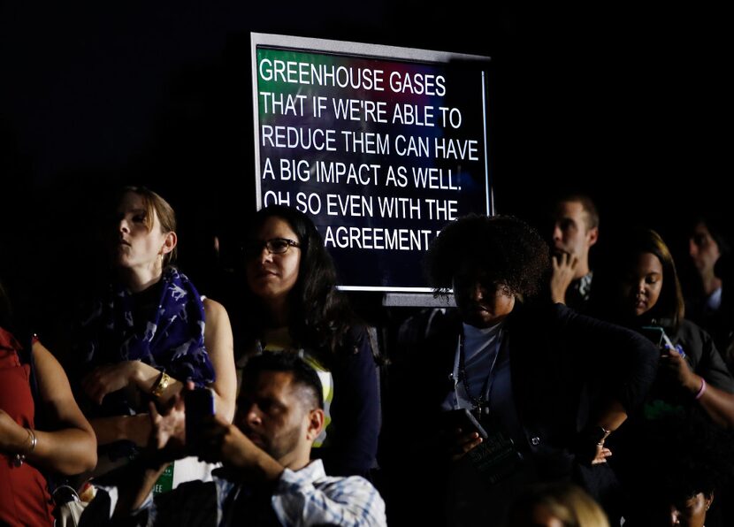 A screen displayed what President Barack Obama, actor Leonardo DiCaprio and Dr. Katharine...