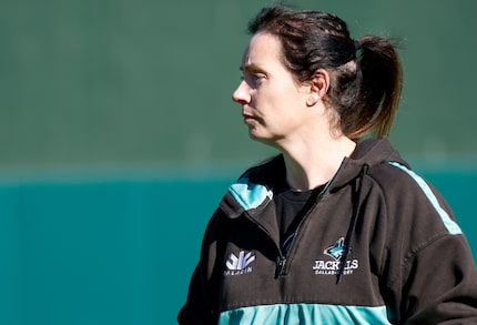 Dallas Jackals general manager Elaine Vassie watches as her rugby players practice at...