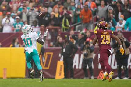 Miami Dolphins wide receiver Tyreek Hill (10) catches a touchdown pass in front of...