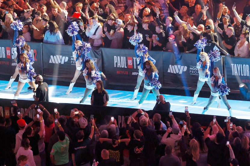 The Dallas Cowboys Cheerleaders perform before a boxing match between Mike Tyson and Jake...