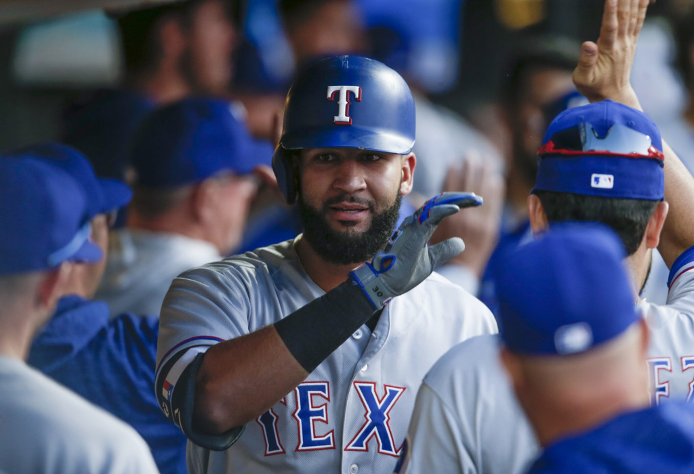 CLEVELAND, OH - MAY 01: Nomar Mazara #30 of the Texas Rangers celebrates in the dugout after...