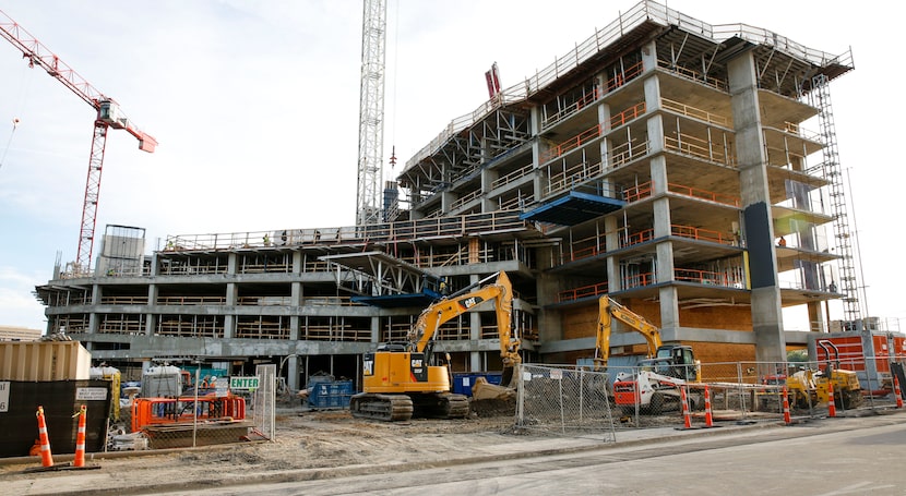 Construction of the high-rise Eastline residential tower off North Central Expressway at...