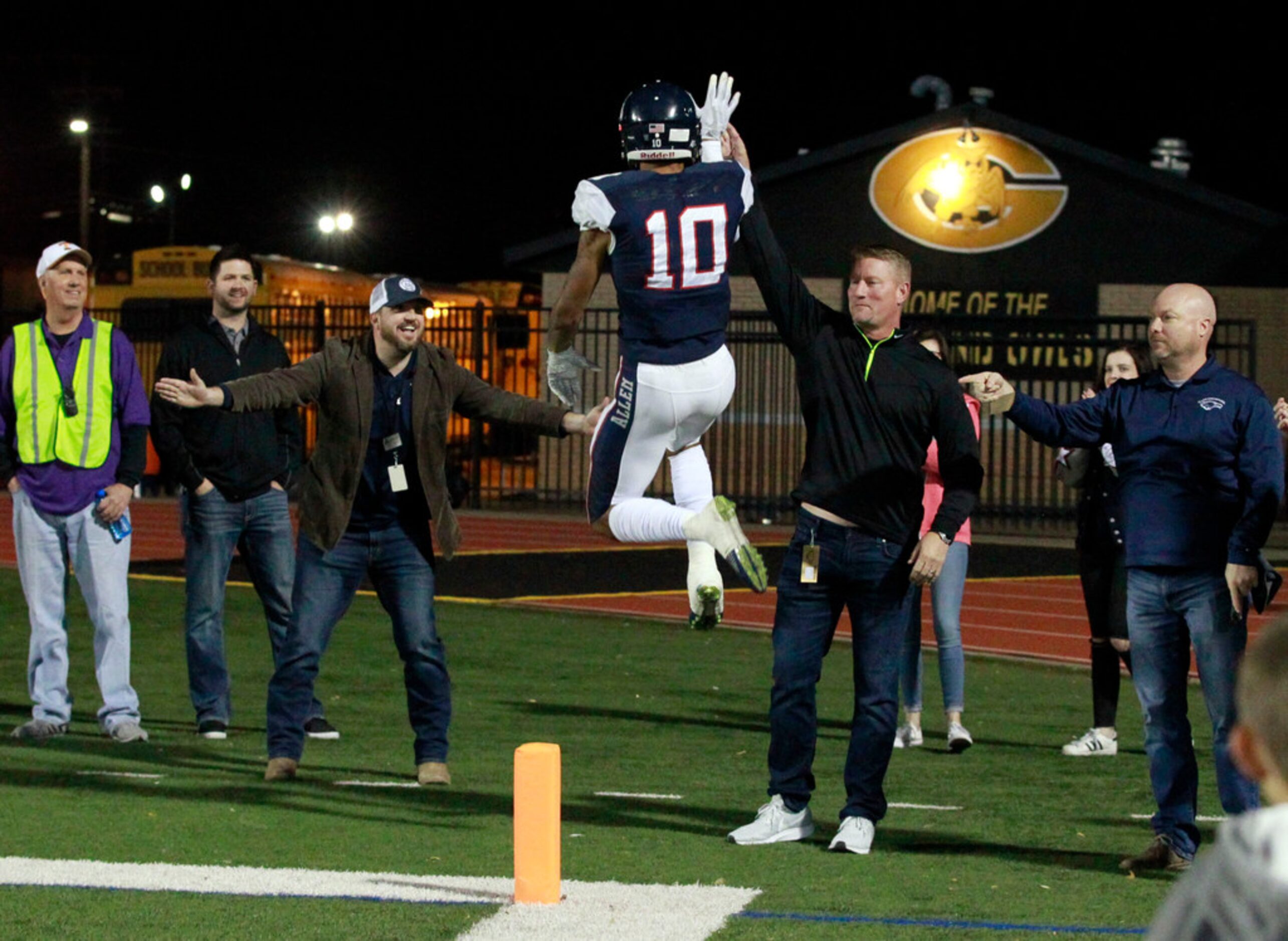 Allen's Theo Wease (10) celebrates with Allen fans in the end zone after scoring the team's...