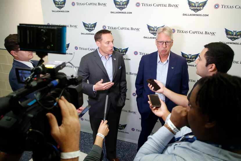 Dallas Wings President and CEO Greg Bibb, left, and head coach Brian Agler talks to the...